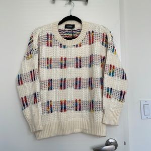 Cream sweater with multicolor design